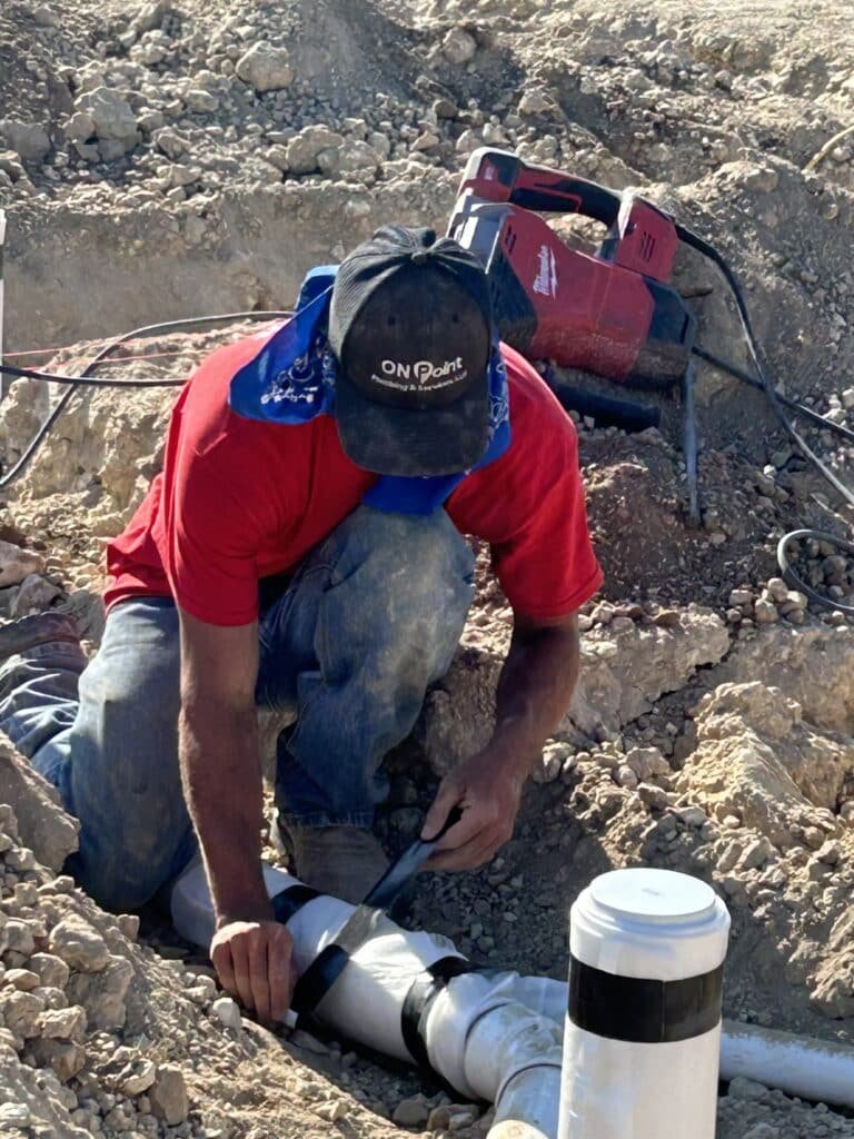 plumber working on water leak