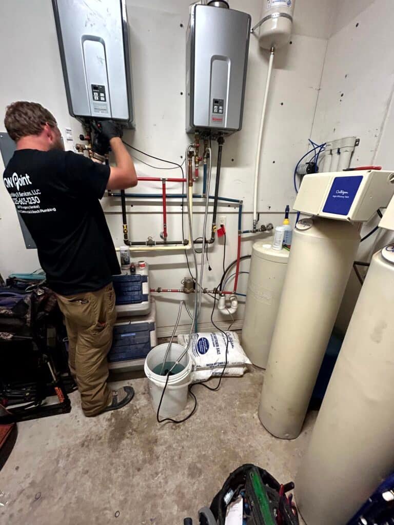 plumber working on pipes