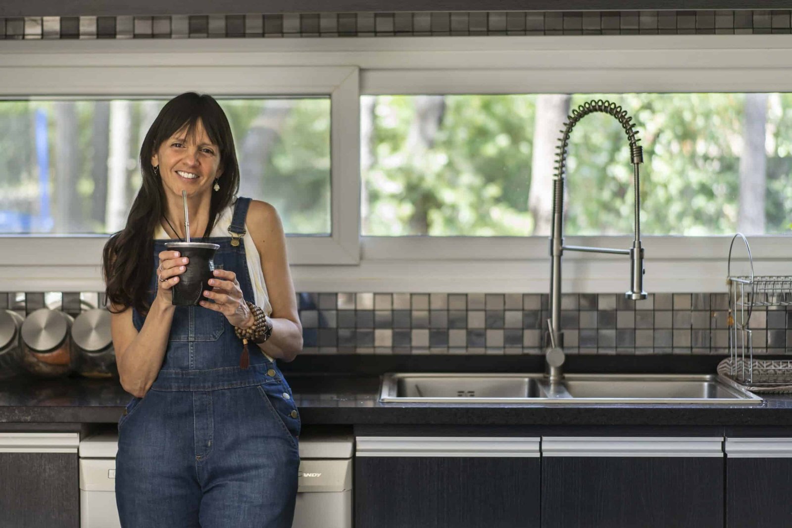 Smiling woman relaxing in a bathtub filled with warm water