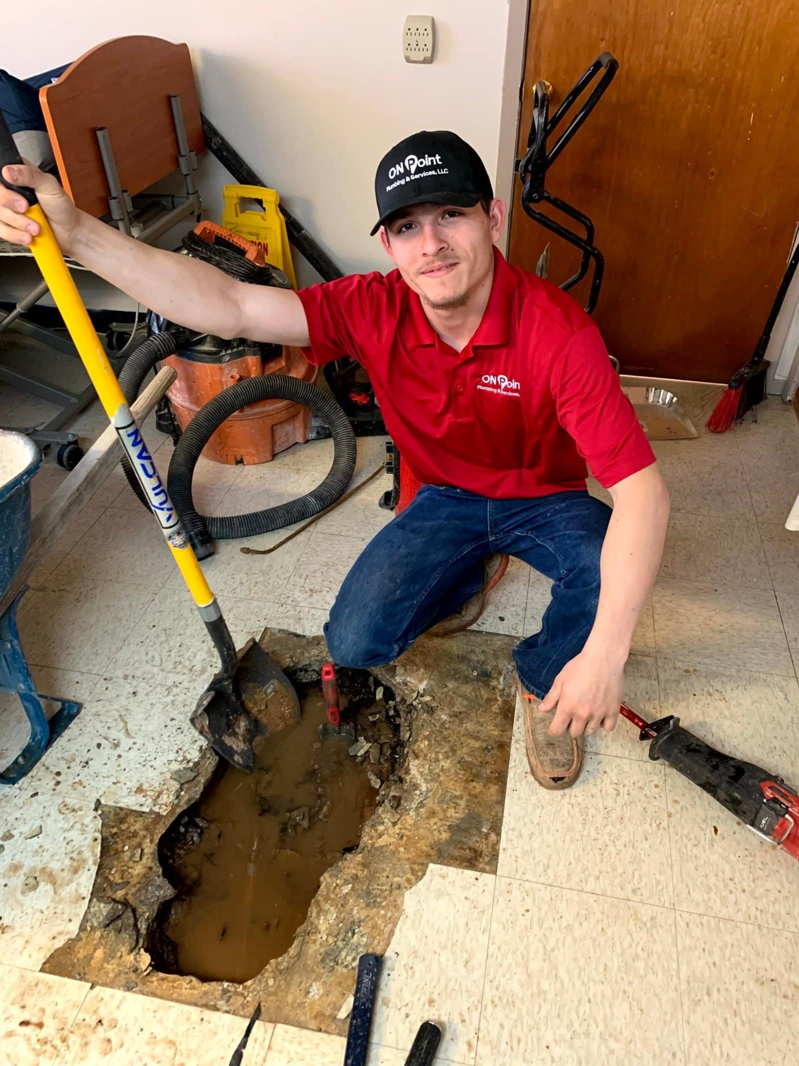Plumber working on commercial plumbing systems
